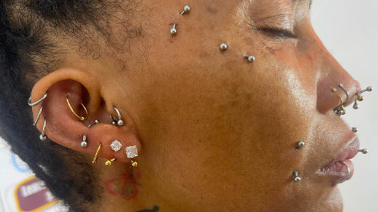 Woman with face piercings