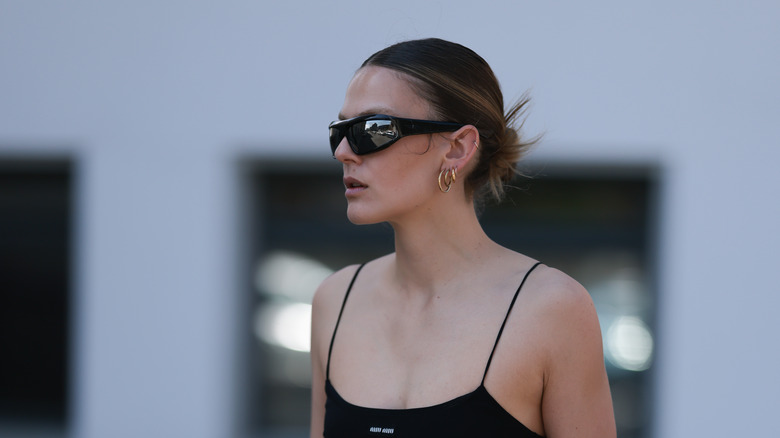 woman wearing stacked gold hoops