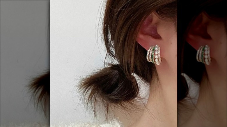 multiple hoop earrings on ear