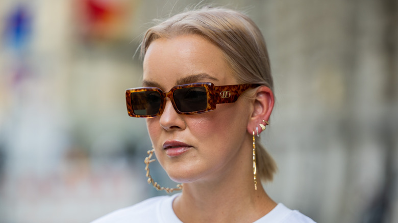 woman in oversized hoop earrings 