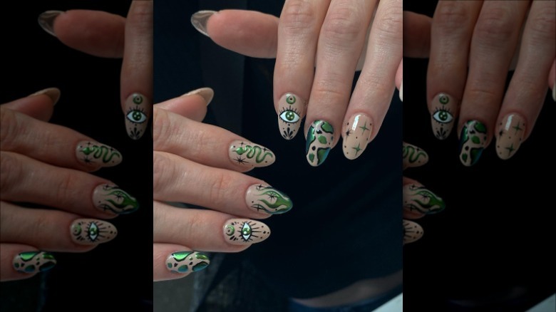 woman with green star eye snake nails