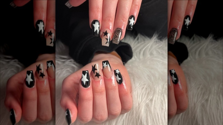 woman with black white star nails