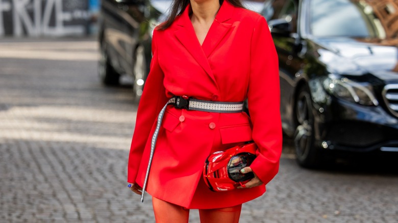 woman wearing measuring tape belt