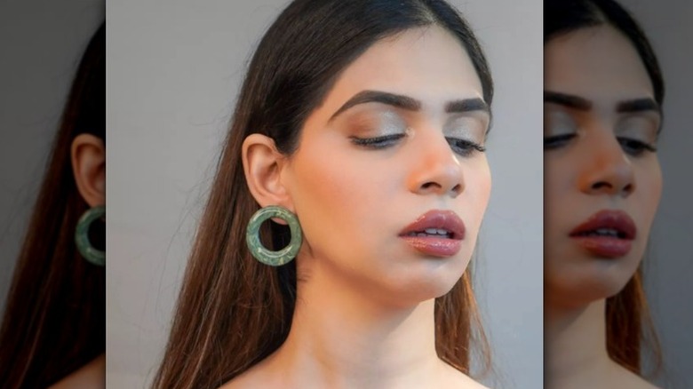 A woman wearing circle earrings