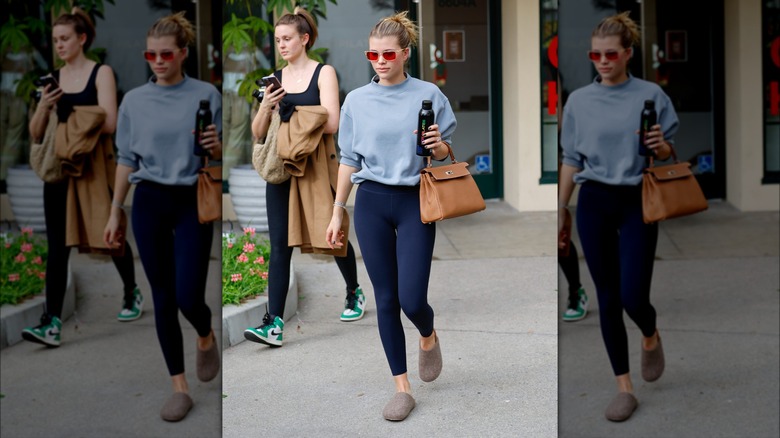 Sofia Richie in a sweatshirt and leggings