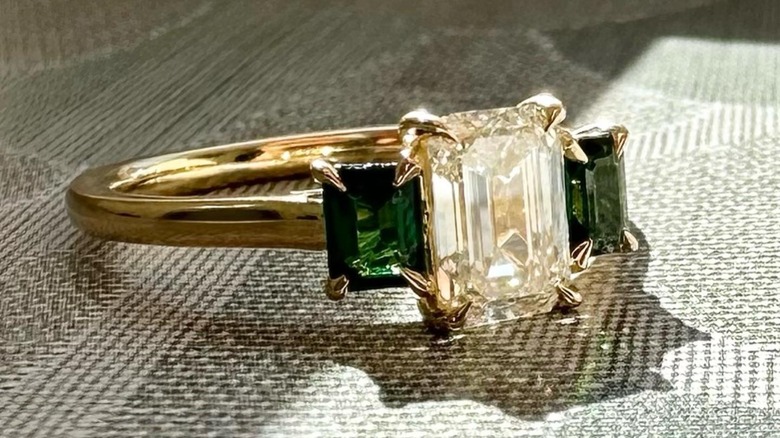 green and clear engagement ring