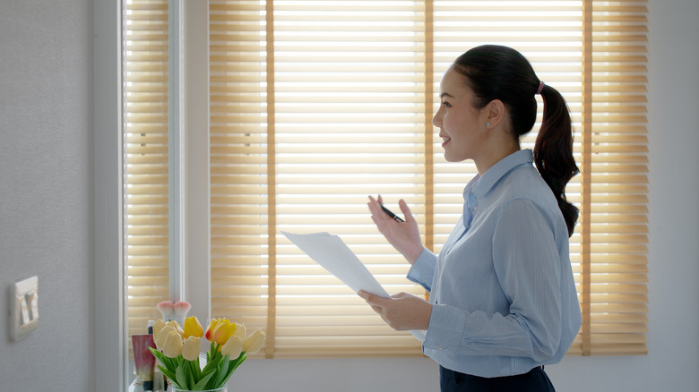 Woman rehearsing near mirror