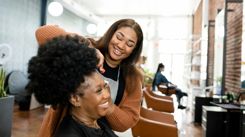 Hairstylist doing a woman's hair
