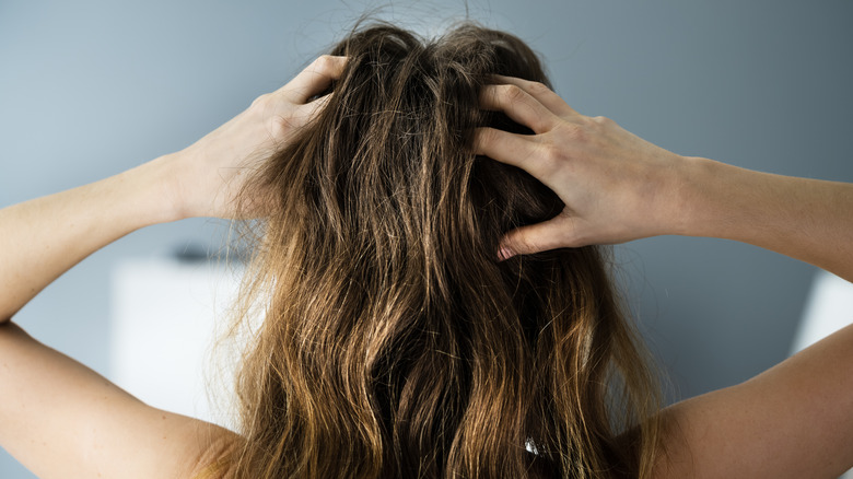 Woman with hands in hair 