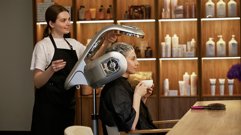 woman under salon dryer