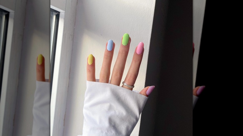 hand with pastel nails