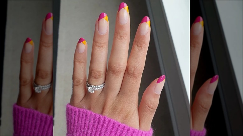 hand with strawberry lemonade french tip nails