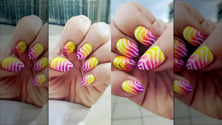 hands with squiggly strawberry lemonade nails