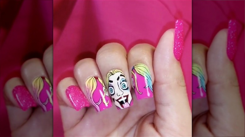 hand with harley quinn manicure