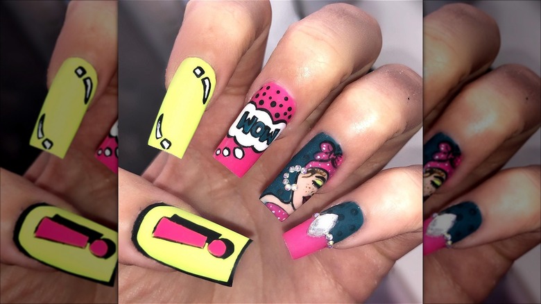 hand with pop art strawberry lemonade nails