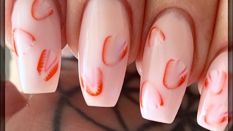 Pink nails with strawberry design