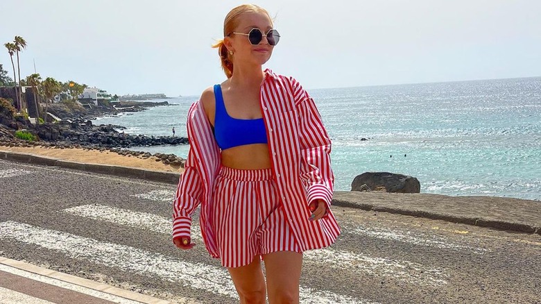 woman wearing red and white striped shorts set