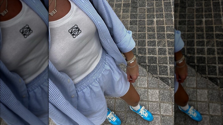 woman wearing blue striped set with blue sneakers