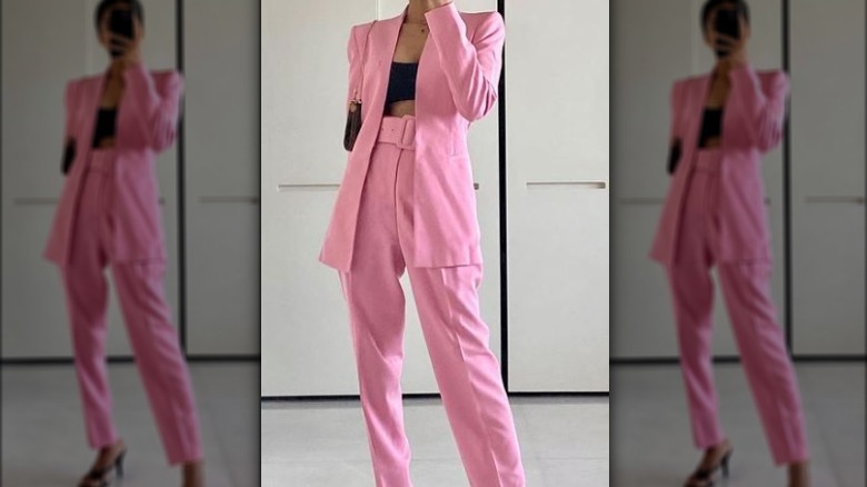 Woman wearing a pink pantsuit