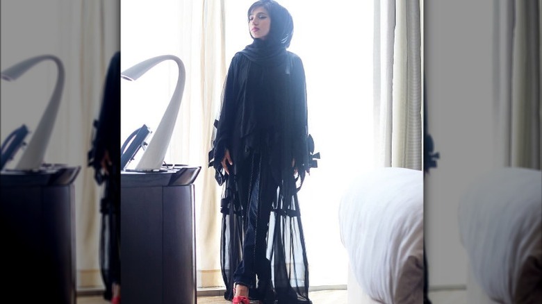 Instagram user @fari91designs wearing sheer black outfit