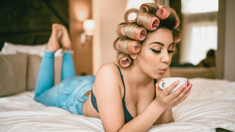 A woman with hair rollers
