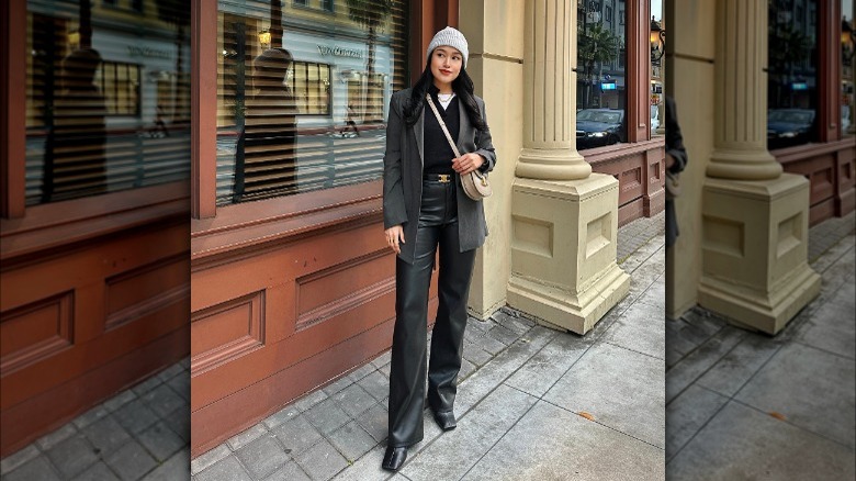 woman wearing black leather trousers and blazer