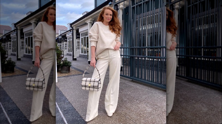 woman wearing white trousers and white sweater