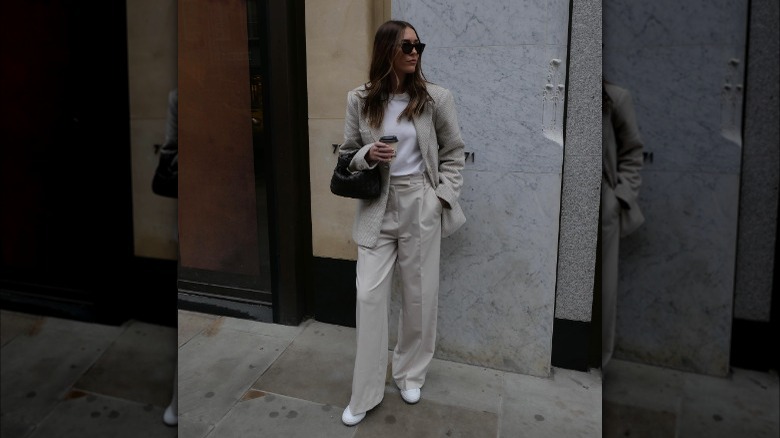 woman wearing oversized cream blazer and trousers