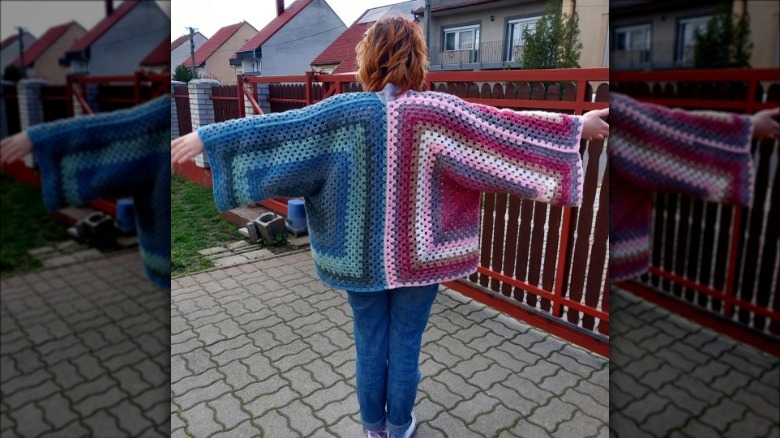 Woman wearing two-tone knit cardigan