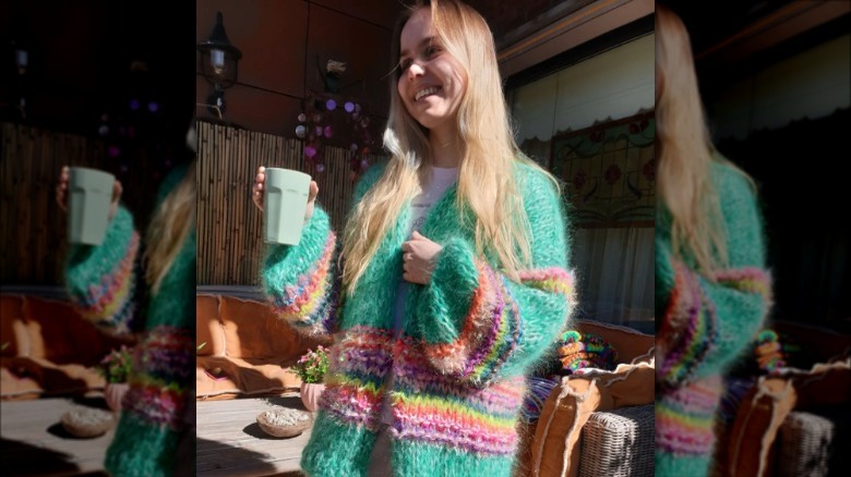 Woman wearing fuzzy knit cardigan