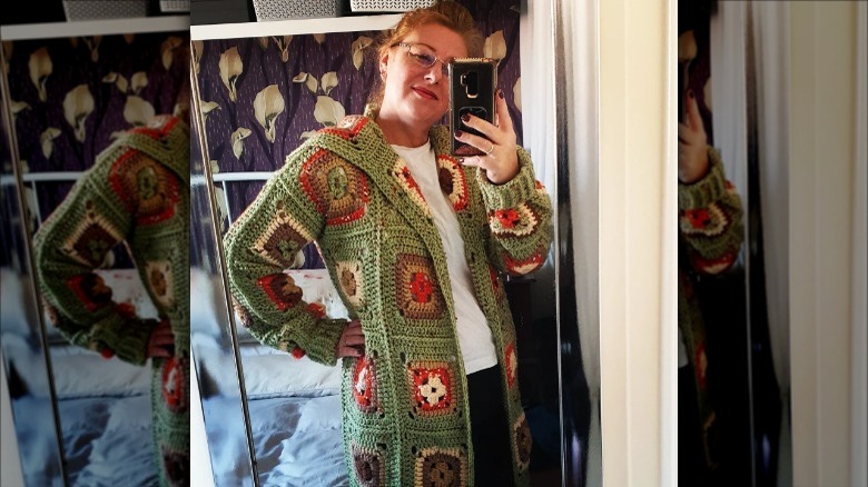 Woman wearing granny square cardigan