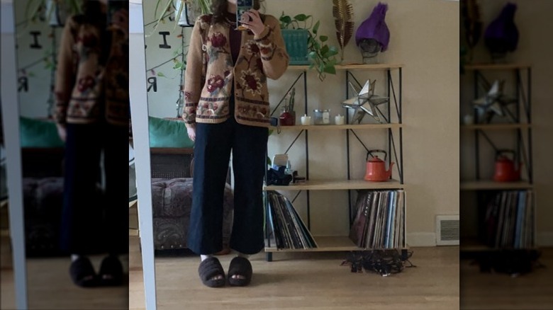 Woman wearing thrifted cardigan