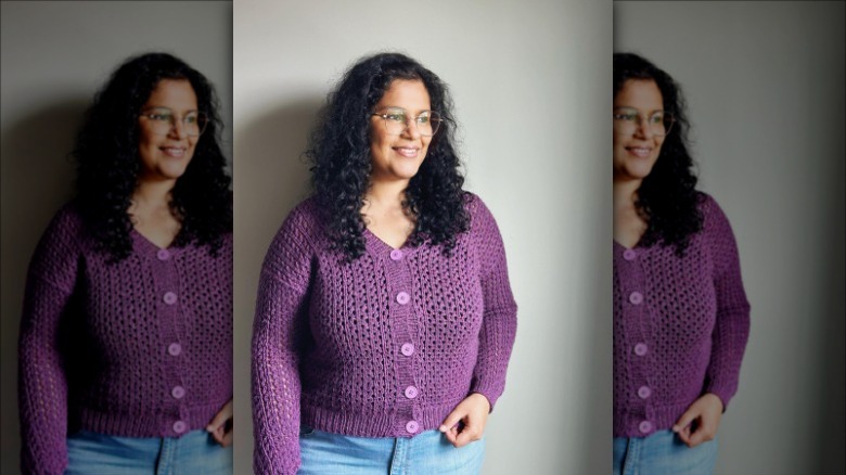 Woman wearing purple knit cardigan