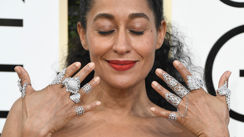 woman wearing stacked rings