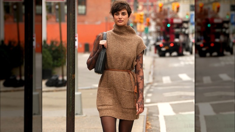 Taylor Hill wearing brown sweater dress