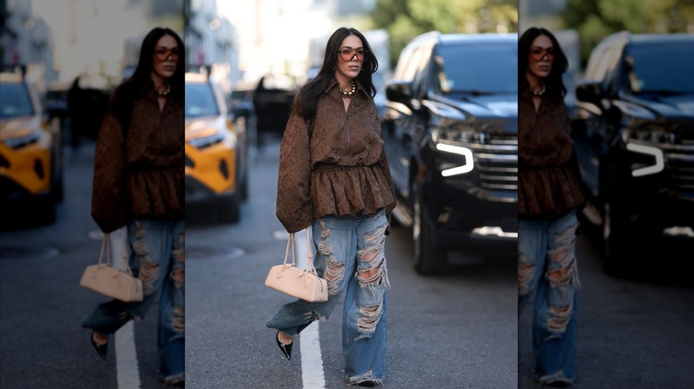 Woman in distressed jeans