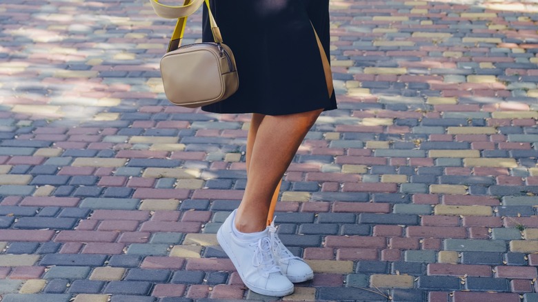 Woman wearing white sneakers 