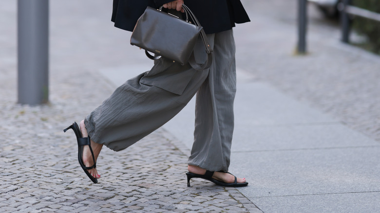 Woman wearing black kitten heels