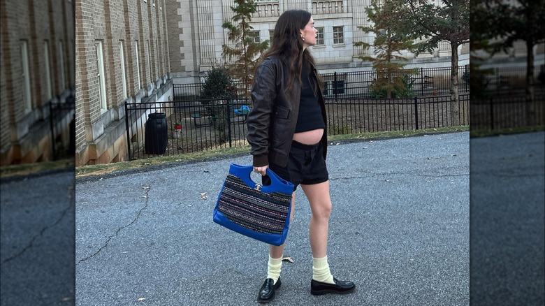 all-black outfit with loafers and socks