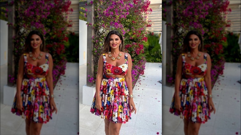 woman wearing bold floral dress