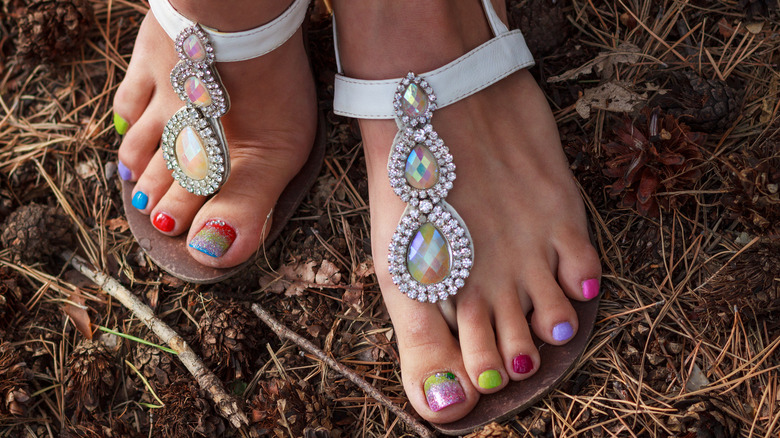Multicolor pedicure in white sandals