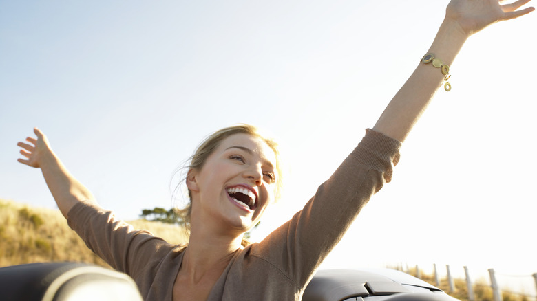 Woman with hands in air