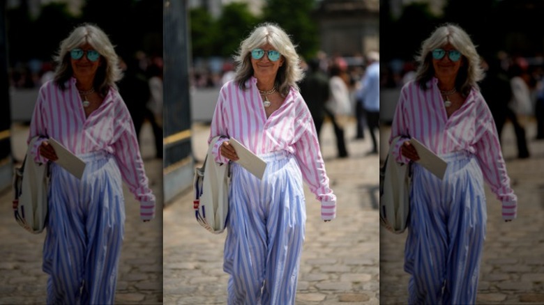 woman wearing pink striped button-up