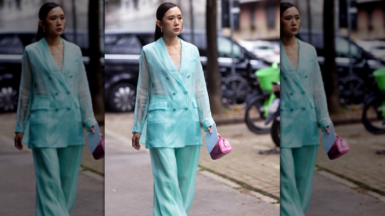 woman in sheer pantsuit