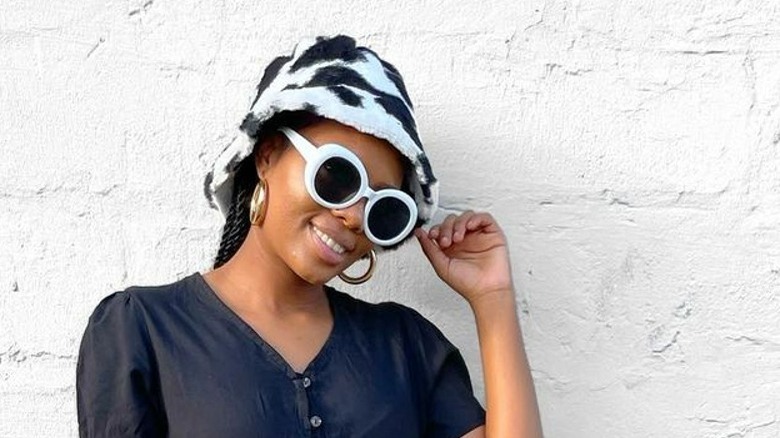 Woman in white sunglasses