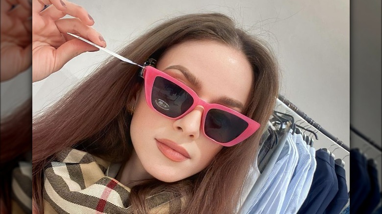 Woman in pink sunglasses