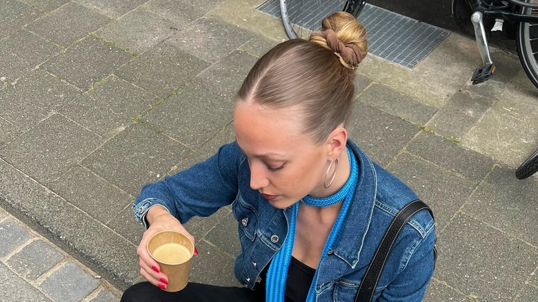 Woman wearing sunwashed blond bun