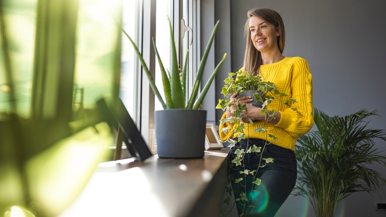 Woman with her houseplants