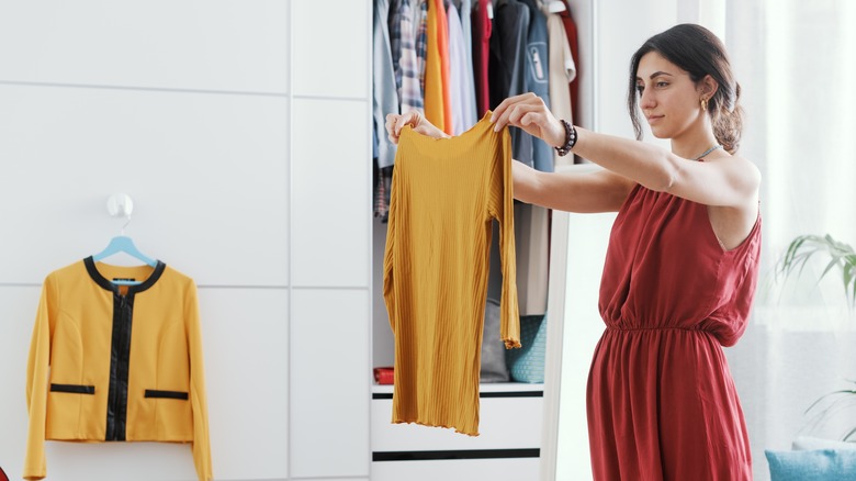 Woman looking at her clothing