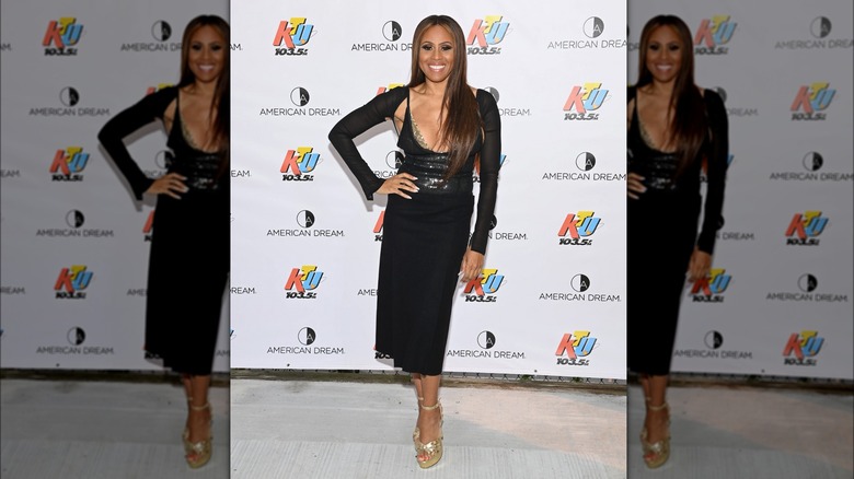 Deborah Cox wearing shrug with dress